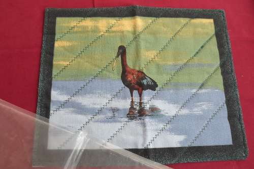 Single padded fabric placemat with bird 37 x 29cm.Handmade .New