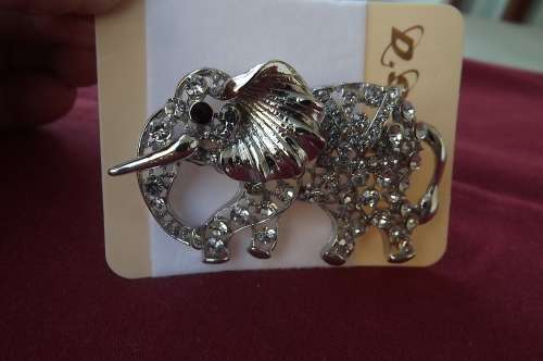 Eyecatching elephant brooch in silver tone with lots of simulated diamonds.New brooch