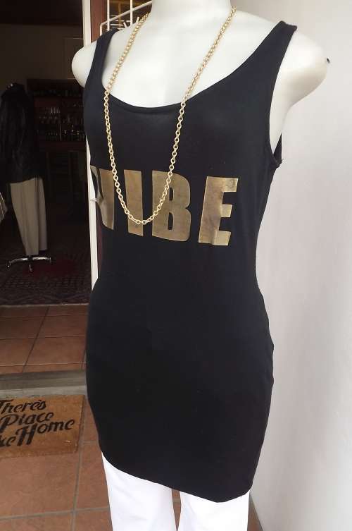 Sexy black vest type long RT top/short dress.Size 32/8.In stretch polyester with gold VIBE logo