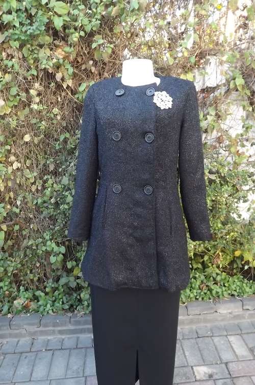 Luxury black glam double breast jacket in size 33/9.Collarless with long sleeves.As new