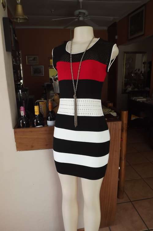Sexy acrylik knit body hugging dress in black,white and red.Size 34/10.Made in Thailand .