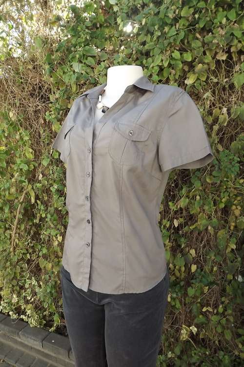 Cgic light brown short sleeve button down top.Two small pockets on front.Size 36/12 by MOZAIC