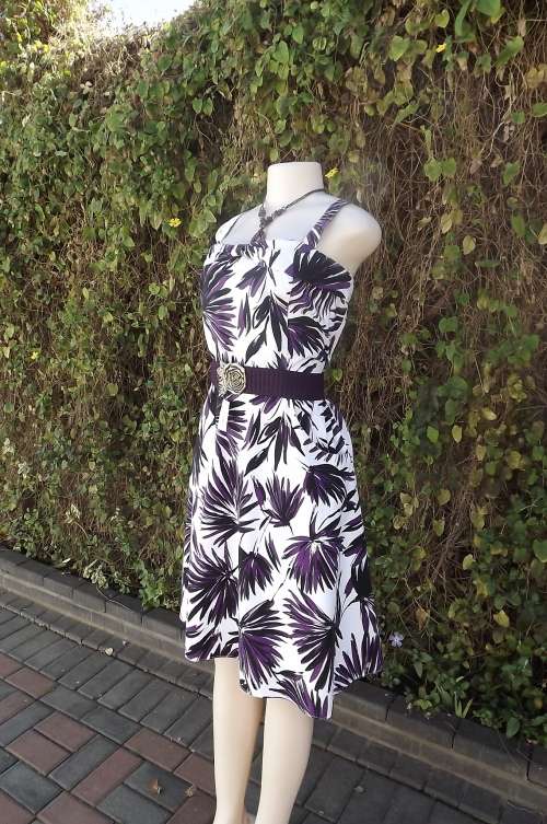 Fully lined 100% cotton sundress in white with purple and black floral pattern.Size 40/16.