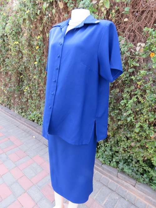 Two piece skirt suite in royal blue.Lined pencil skirt with slit at back.Size 40/16.As new