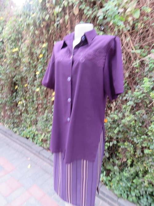 Classic long dark purple button top by A+V in wash + wear polyester.Size 38/14.Shirt collar.
