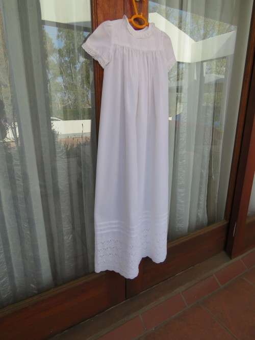 Lovely white 100% pure cotton christening dress.Length from shoulder to seam 92 cm.