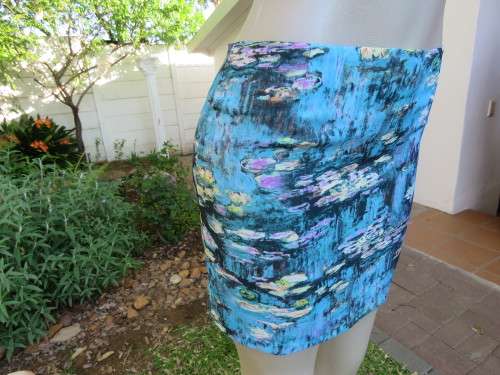 Cute blue mini pencil skirt by PAGE from Korea.Size 33/9.Zip at back.New item