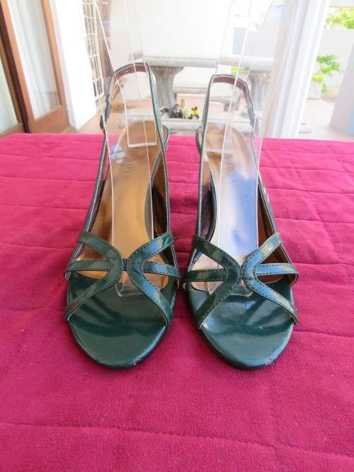 Pair of hunters green high heel sandles by MILAYS in size 5.Used but in good condition