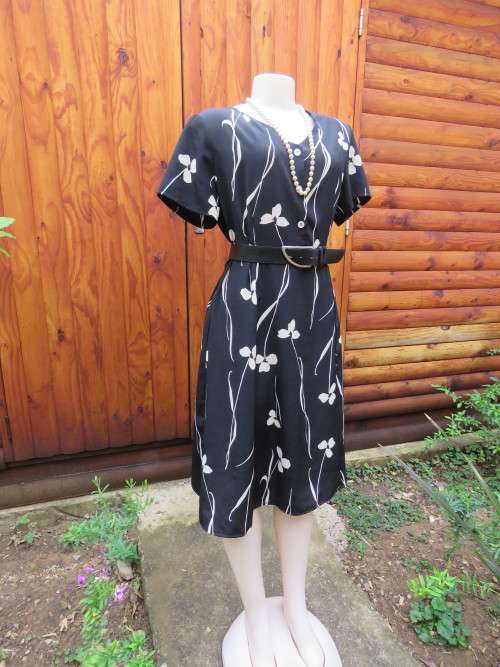 Empire style a-line black polyester dress with cream floral pattern.By ASPIRE.Size 40/16