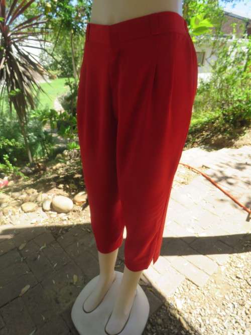 Fabulous bright red cropped light weight polyester pants.Size 40/16.As new by KKK