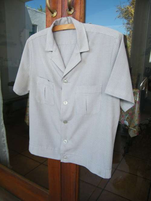 Men`s safari suite jacket.Size Small chest 108cm.In polyester and viscose blend.As new