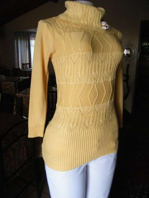 Make a statement in this buttercup yellow poloneck acrylic/cotton blend size 34/10.Knitted top.
