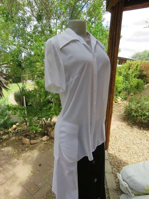 Delicate sheer white button down OASIS size 32/8 short sleeve top.Slitted sides.As new