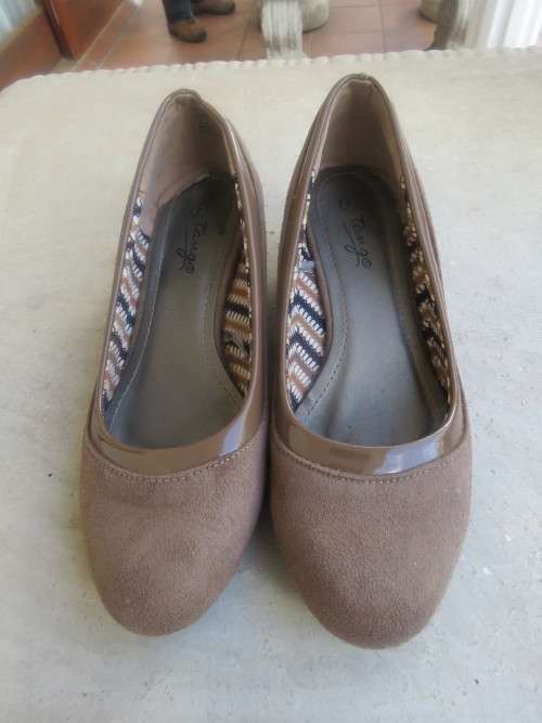 Pair of Ecru colour wedge heel size 4 shoes by TANGO.Soft inner.Good condition.