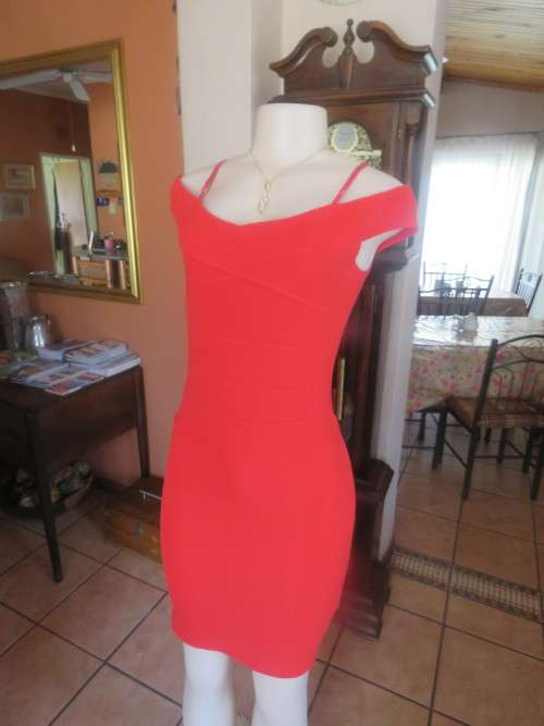 Sassy hot red stretch polyester bodycon dress with clean sexy lines.Size 32/8 by ASOS.