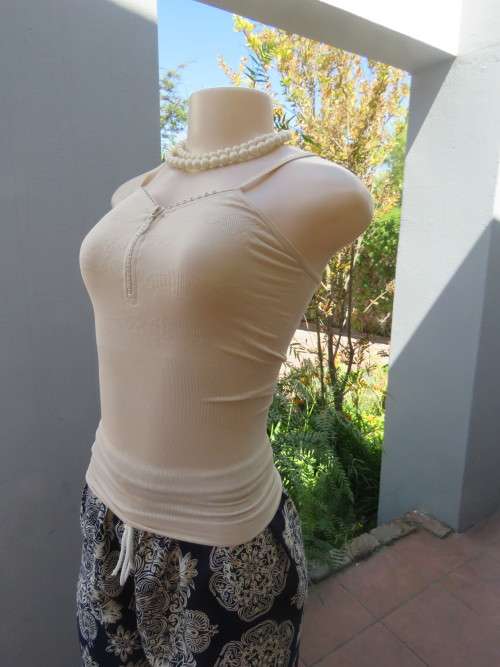 Cami type stretch top in natural colour.Size small.Perfect fit.New condition