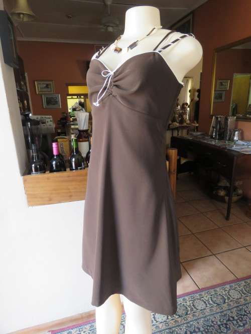 Choc brown 100% heavy polyester strappy dress.Size 34/10.Owner made.Side zip. Very good condition.