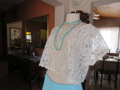 Cropped voluptuous cream acrylic lace top with short cut-on sleeves by CUTE BEAUTY in M