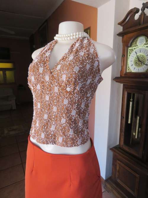 dainty acrylic lace halter neck sexy top in golden brown and white.Size 34/10 by IN WEAR
