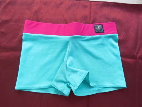 Turquoise and pink lycra short by DANZONE in size 32/8. New condition.