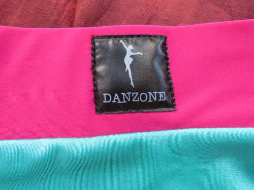 Turquoise and pink lycra short by DANZONE in size 32/8. New condition.