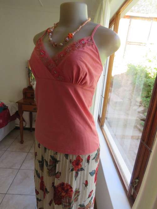 Sexy strappy LIZZY top in coral colour.In stretch cotton.Size 36/12.Adjustable straps.Good cond