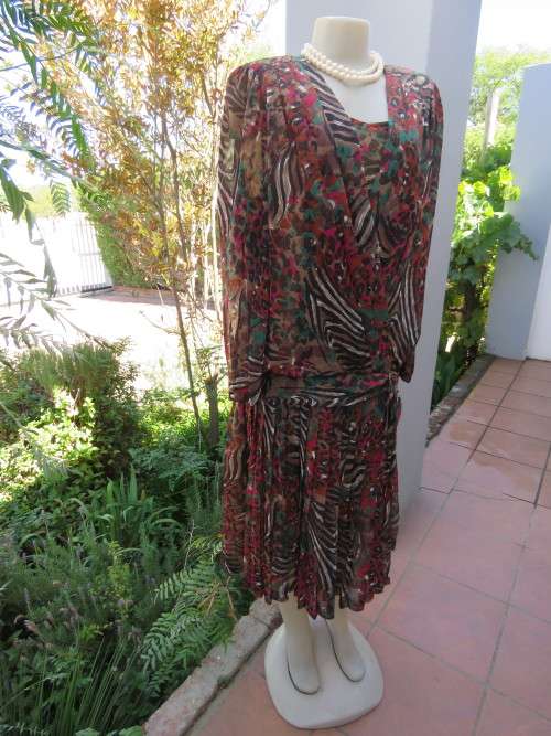 Dark patterned sheer silky 100% polyester vintage dress with dropped waist.Size 36/12 By MISS LYNN