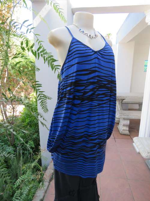 Sexy blue and black strappy long top with unique sides by RT in size 36/12.New condition