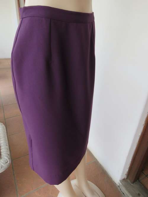 Dark purple calf length pencil skirt in 100% wash + wear polyester fabric by MICHAELA.