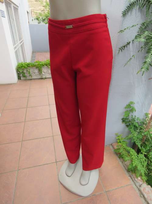 Dark red size 34/10 pants with zip at side and no pockets.Straight legs.Buckle decoration on front