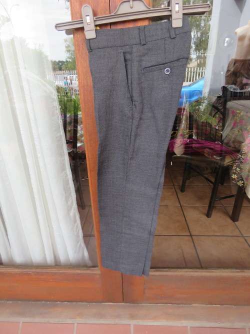 Grey pants for boy 7 to 8 years old. In polyester/viscose blend by CHANCELLOR BOY .Good condition