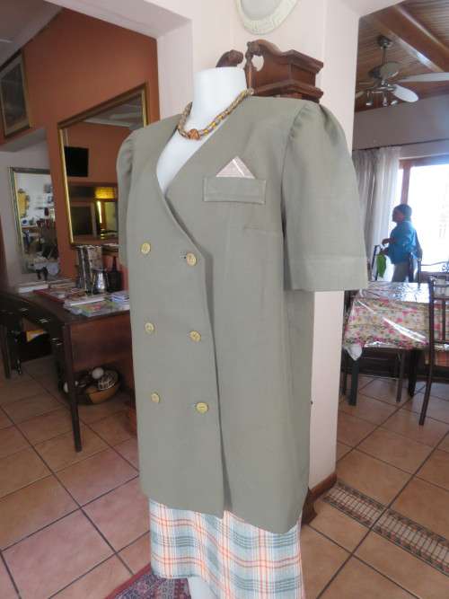 Fabulous extra long olive green short sleeve double breast jacket.By RUTH REED size 42/18.As new.