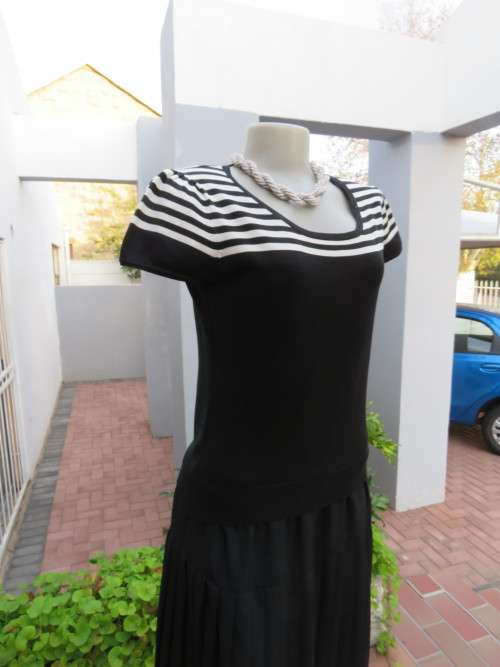Black capped sleeve knitted top with black and white striped yoke by INSYNC in 34/10.Everyday wear.