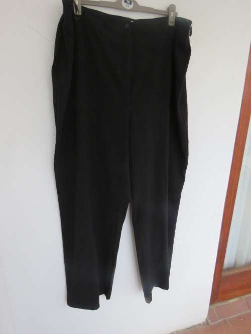 Black PENNY C pants in size 52/28.Straight legs with some tapering toward leg seams.As new.