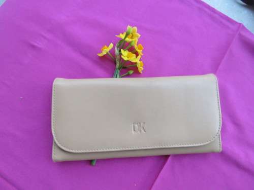 As new rich cream ladies purse by DK.Lots of packing space.Size 21 x 11 cm.Good condition.