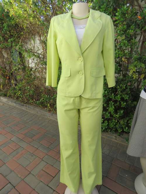 Neon green 2 piece pant suit.By FASHION EXPRESS in size 36/12.Good condition.