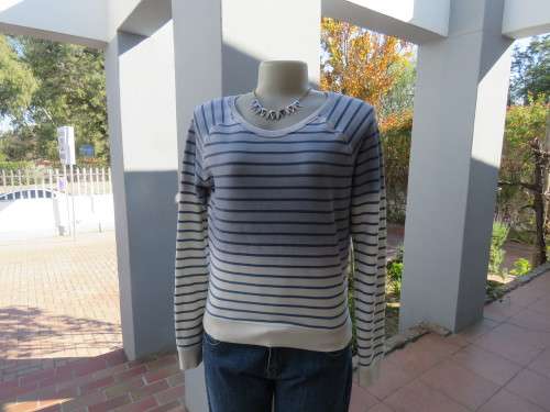 White and blue horizontal striped top in size 34/10.Warm poly cotton stretch fabric.Good condition.