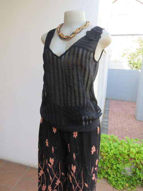 Evening black sleeveless top with V-neckline.By `KOOKAI` size 32/8.Wear over cami.New.