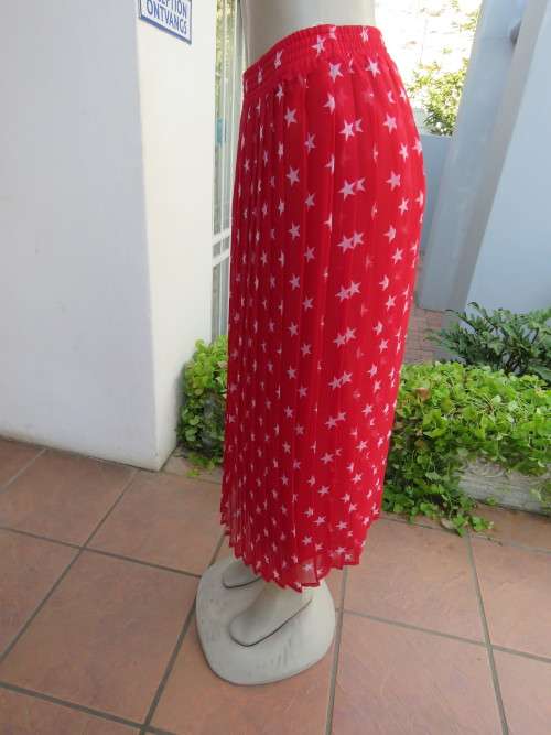 Irresistible red sheer polyester ankle length skirt.Size 36/12.Permanent pleated.New condition.
