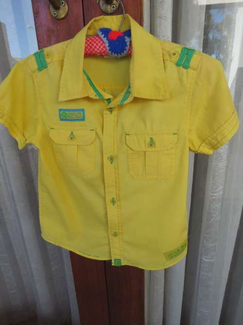 Bright yellow short sleeve shirt for boy of 6-7 yrs.By 'WAGA DUDE'.Good condition.