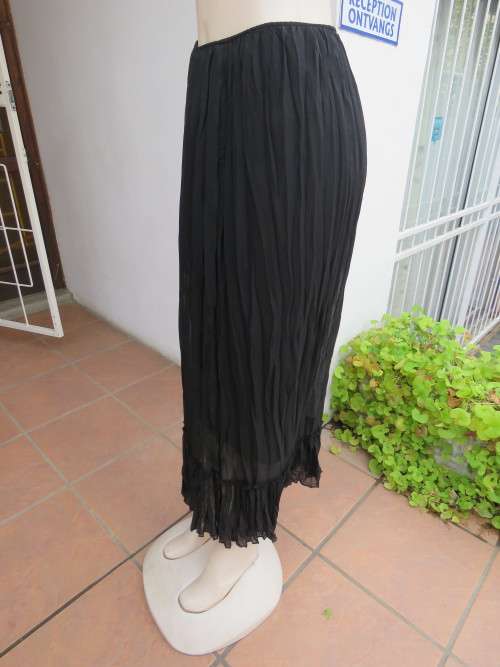 Maxi frilled skirt fully lined.In creased sheer black polyester fabric.Size 34/10 .As new.