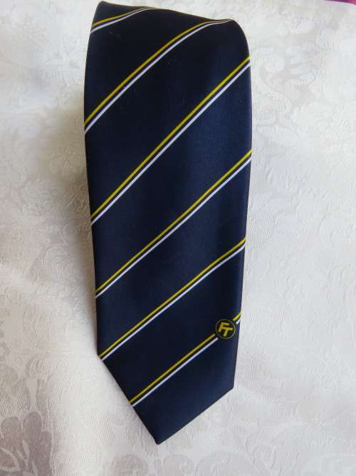 Men`s LOGO  FT dark navy tie with diagonal thin yellow and white stripes..Width 8cm.New condition.