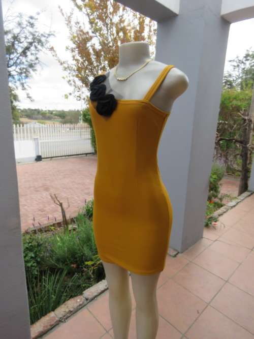 Sexy mustard bodycon mini dress in textured stretch polyester.Boutique made in 30/6.As new.