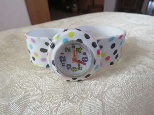 Cute white with colourful polka dot kids watch.In bendable rubber.Working.New item.