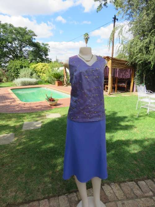Special occasion 2 piece skirt outfit in periwinkle colour.Boutique made in 42/18.As new.