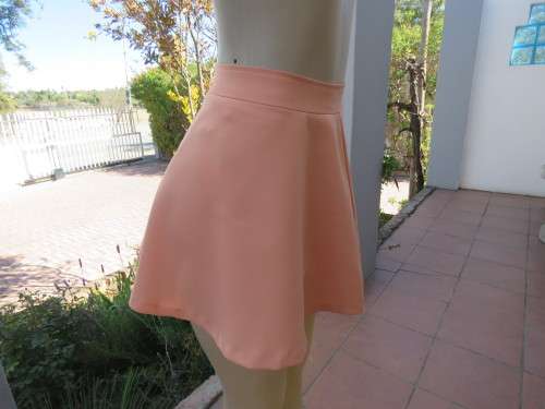 Sexy light peach skater style skirt by 'PAGE'.Made in Korea in size 30/6.Fully lined.New item.