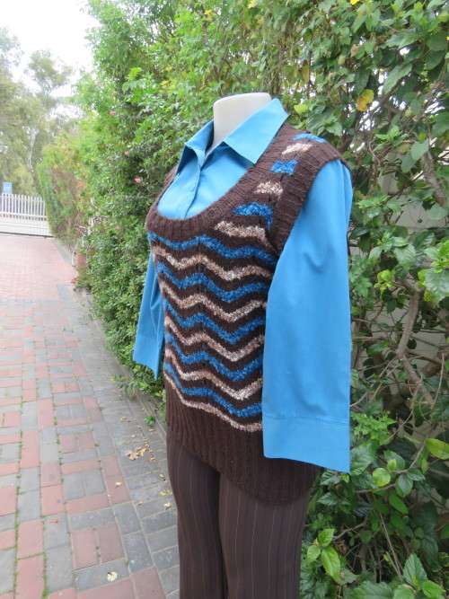 Notice me brown and turquoise pull over with low rounded neckline by `INSYNC` in 32/8.New condition.