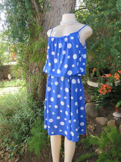 Royal blue/white polka dot strappy dress from the 80's.Size 40/16.In stretch polyester.Good cond.