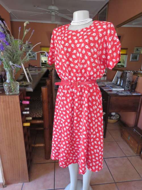 Red dress with white hat print in silky polyester fabric.Made by owner in size 42/18.As new.
