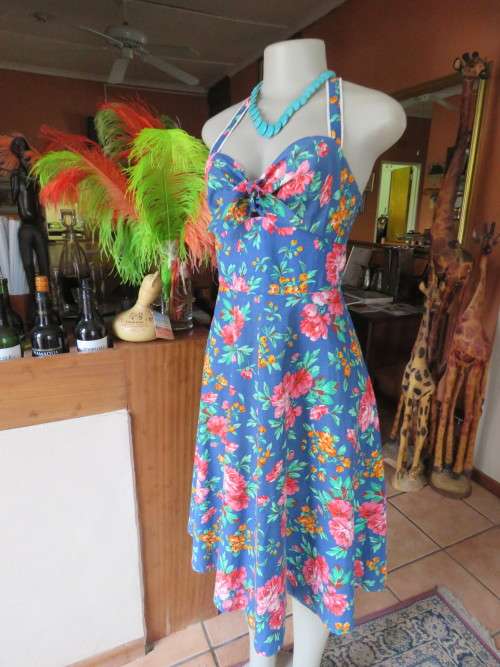 Flirty royal blue halter neck dress in size 36/12 lively floral print in 100% cotton.Good condition.